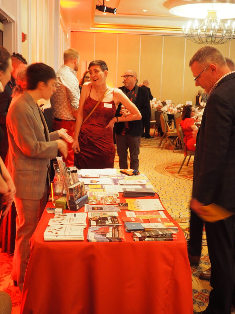 A guest looks at CHN pamphlets at a table