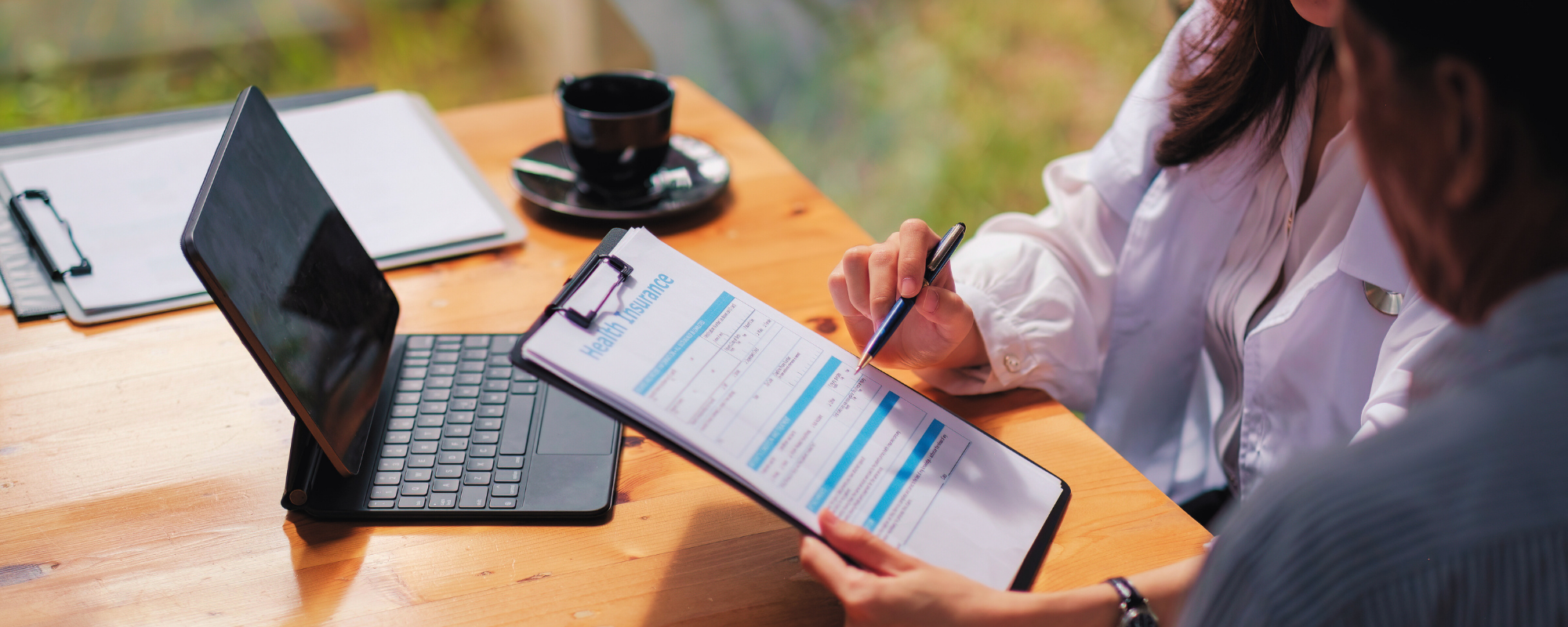 CHN Health Access Program Coordinator meeting with a client living with HIV to review health coverage options in Colorado.