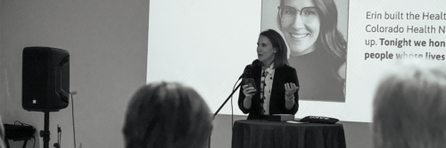 Erin Burk-Leaver of Colorado Health Network accepting the Kenneth Greenberg Excellence in HIV Award at Vivent Health's Make a Promise event.